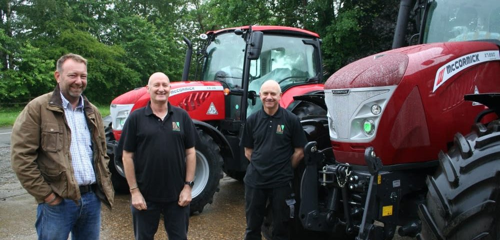 Venture Farm Machinery partners Jim Pearson and Nigel Gardiner with Derek Lispcombe.