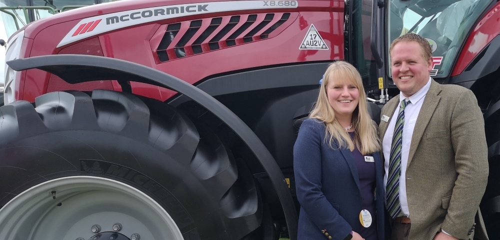 Show Liz and David Moore with a McCormick tractor